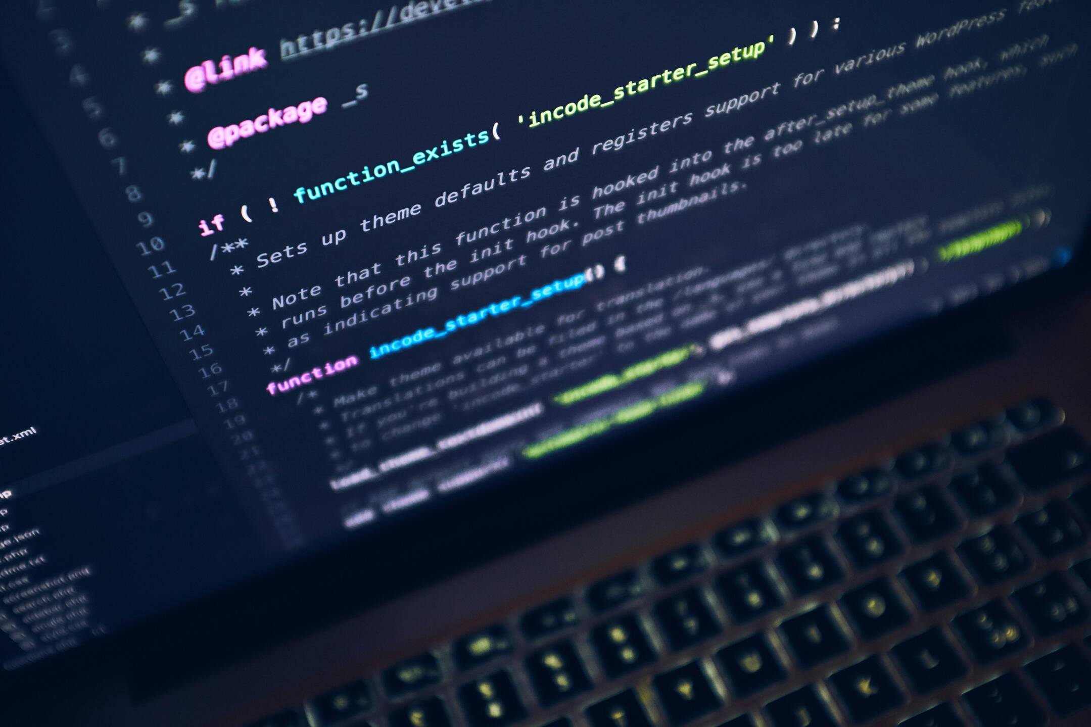 A partial picture of a laptop screen with computer code